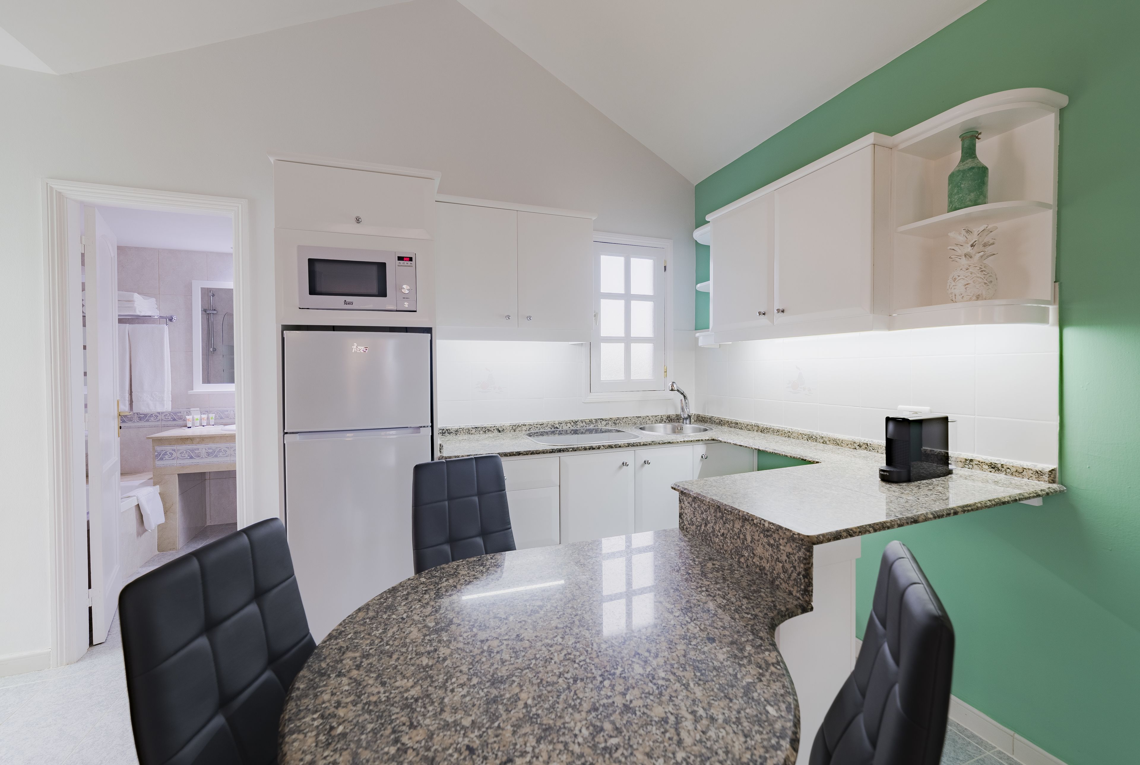 full-sized fridge, microwave, stovetop, coffee/tea maker