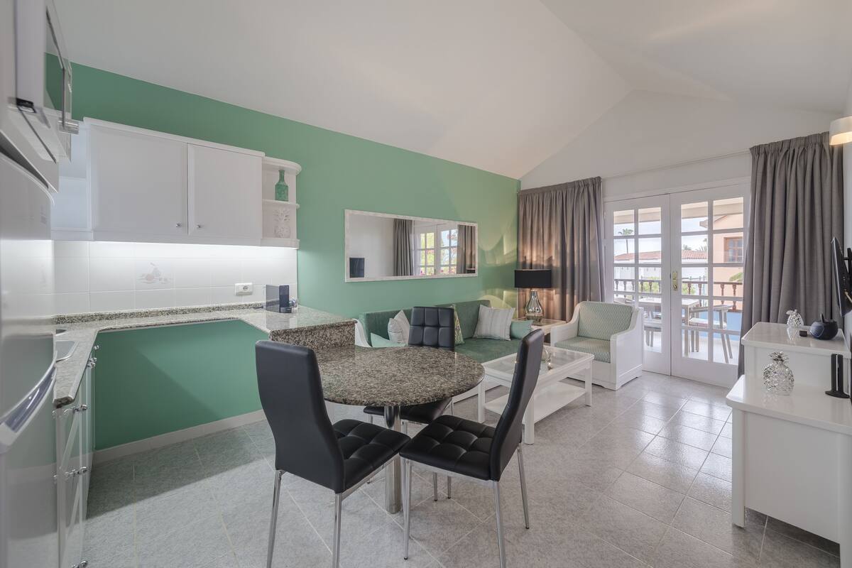 full-sized fridge, microwave, stovetop, coffee/tea maker