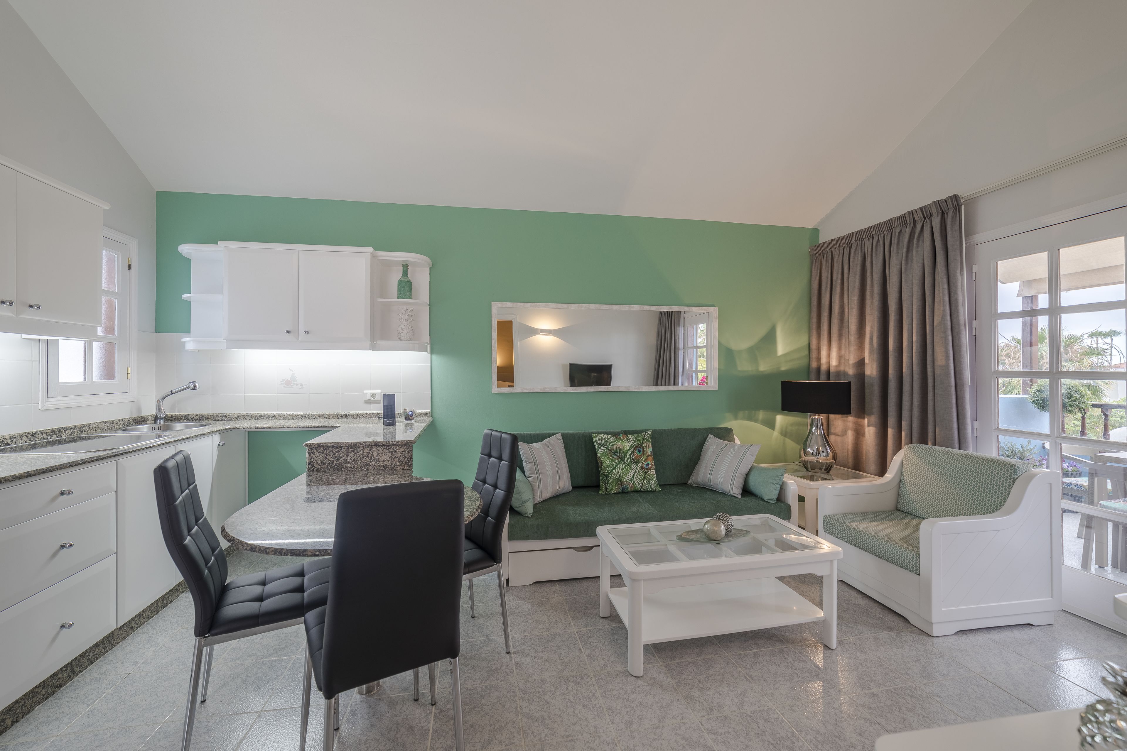 full-sized fridge, microwave, stovetop, coffee/tea maker