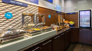 A buffet area with labeled sections for hot food, cereal, fruit, yogurt, eggs, and milk. - Holiday Inn Express Hotel & Suites Riverport Richmond by IHG (Richmond)