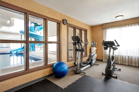 Fitness facility. Days Inn & Suites by Wyndham Strathmore