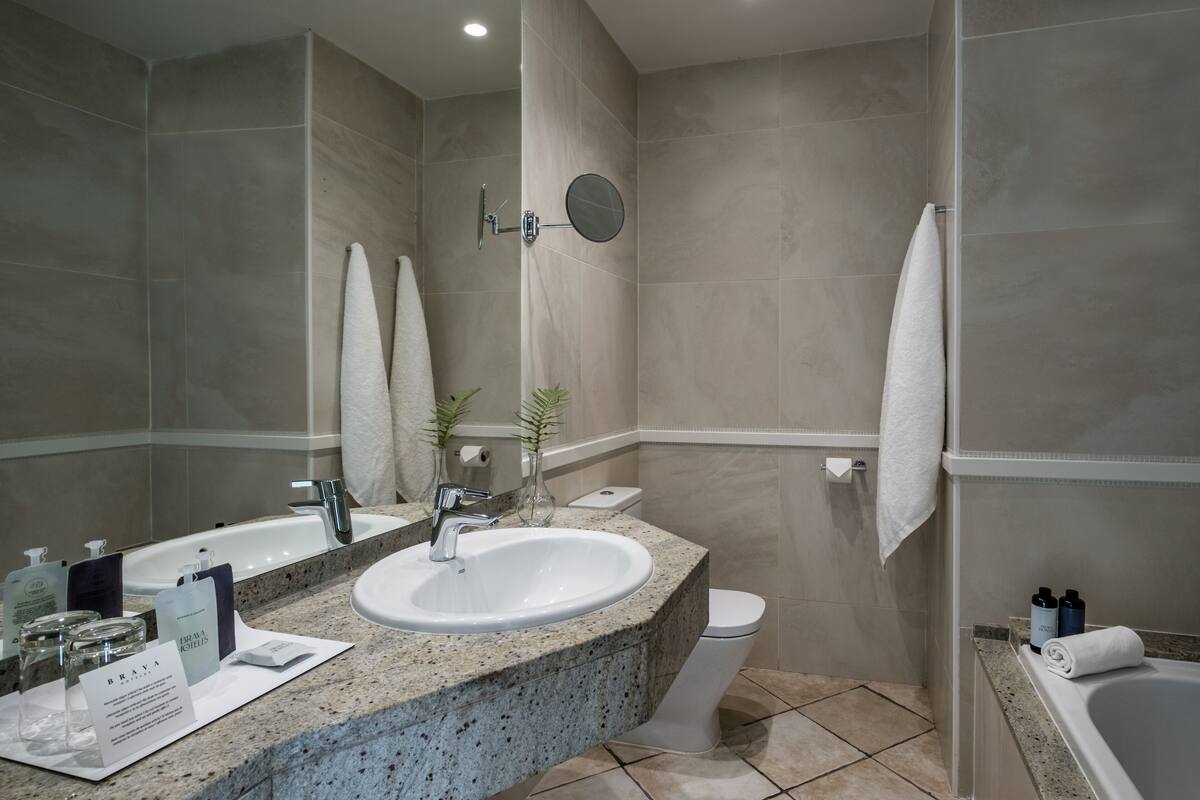 superior double room, sea view | in-room safe, desk, iron/ironing board, cots/infant beds