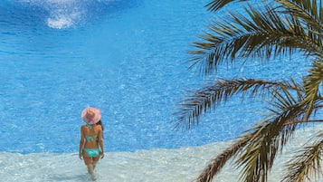 Indoor pool, outdoor pool, pool umbrellas, pool loungers