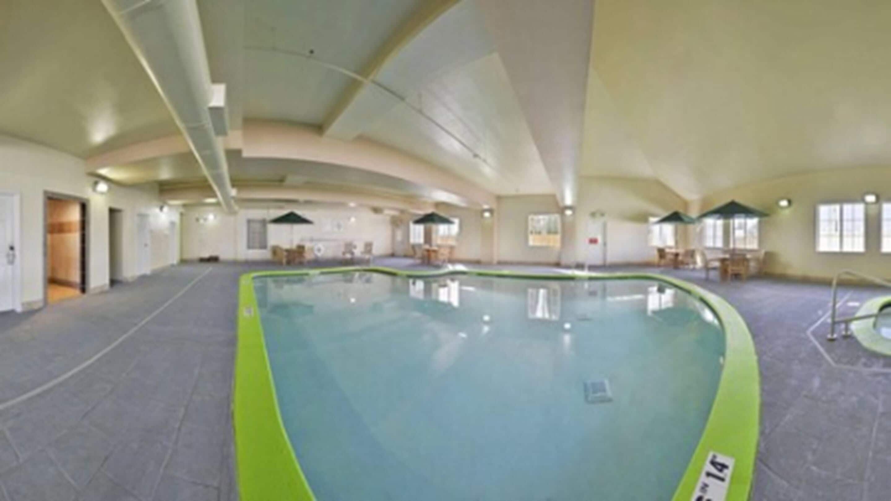 Indoor pool, open 7:00 AM to 10:00 PM, pool umbrellas, sun loungers