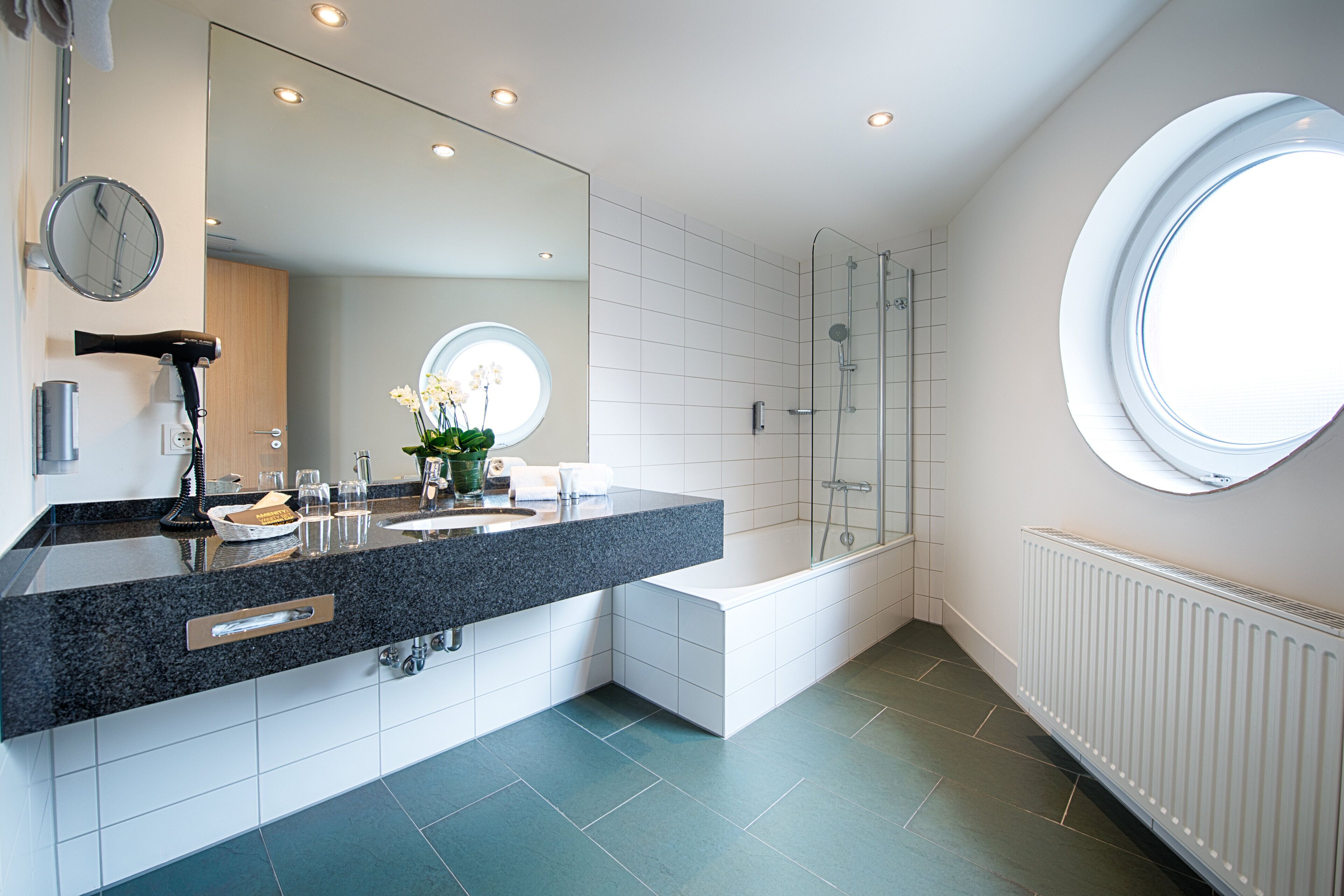 deluxe double room | bathroom | eco-friendly toiletries, hair dryer, towels, soap