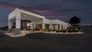 A modern building with a covered entrance, large windows, and a well-maintained landscaped area. - Quality Inn Wytheville (Wytheville)
