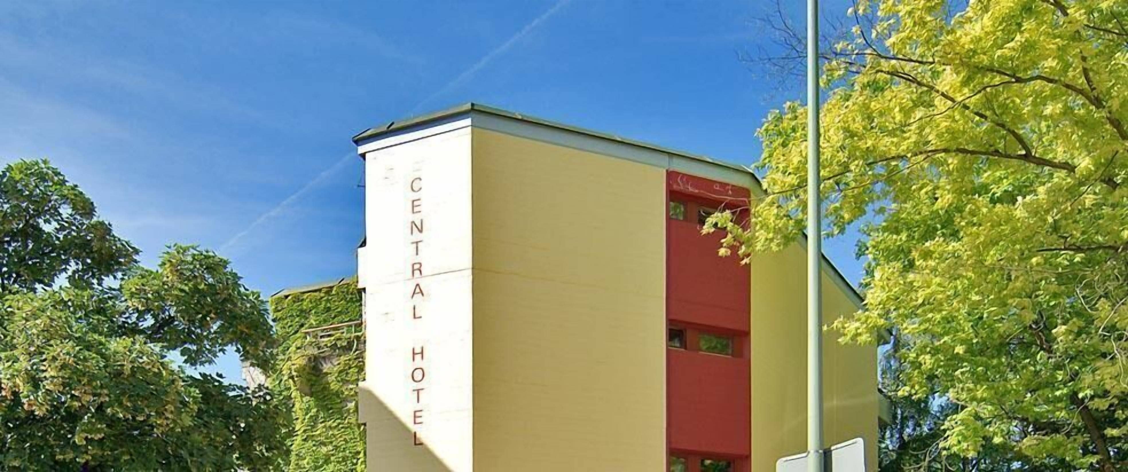 A building with a sign reading "CENTRAL HOTEL".