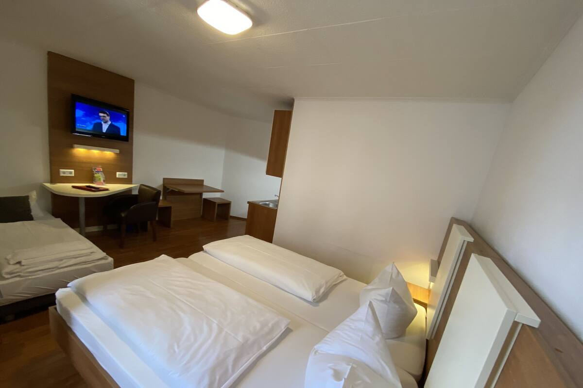 Triple Room | Desk, blackout drapes, iron/ironing board (on request), WiFi (free)
