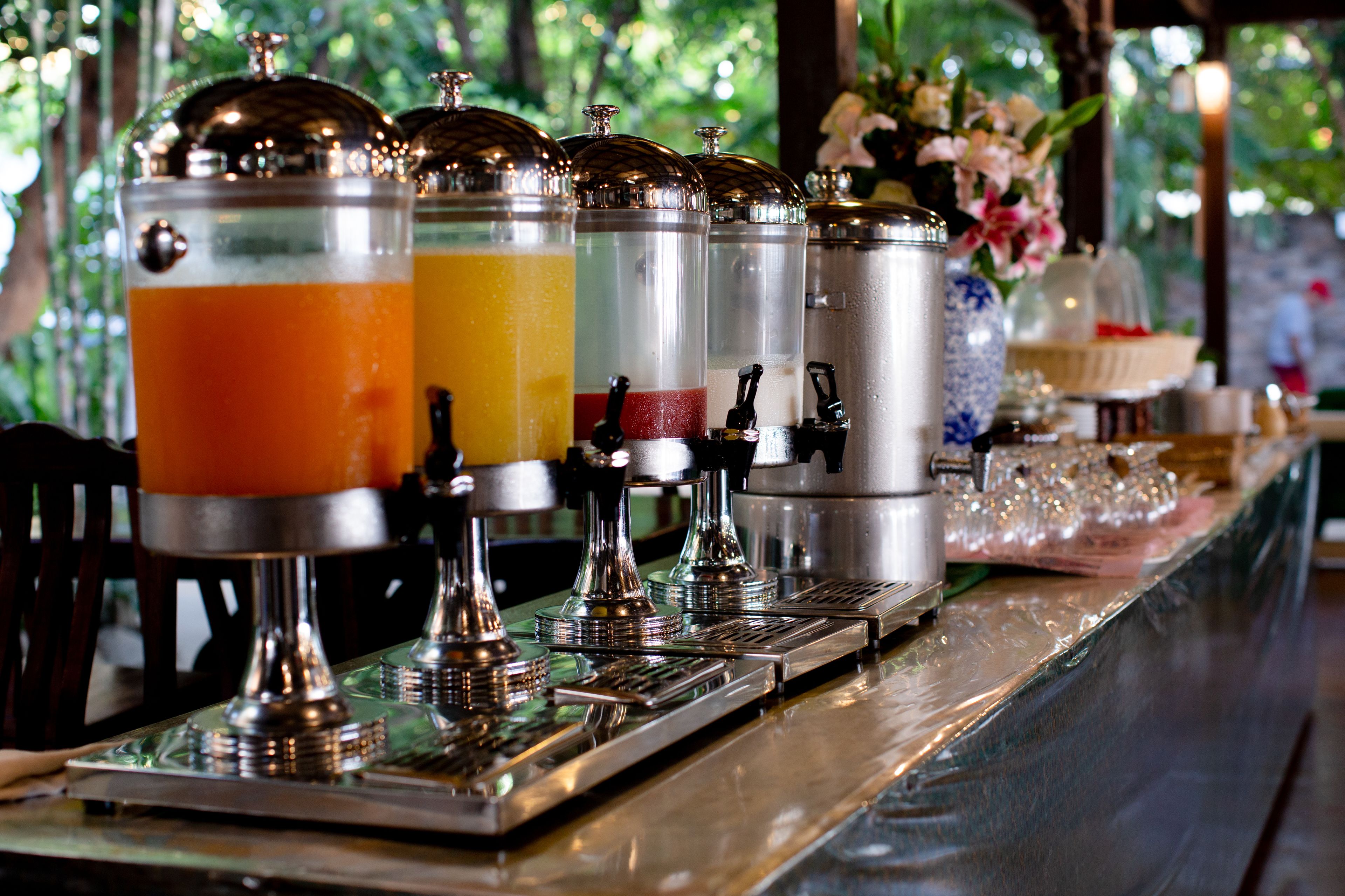 A beverage dispenser station with multiple containers.