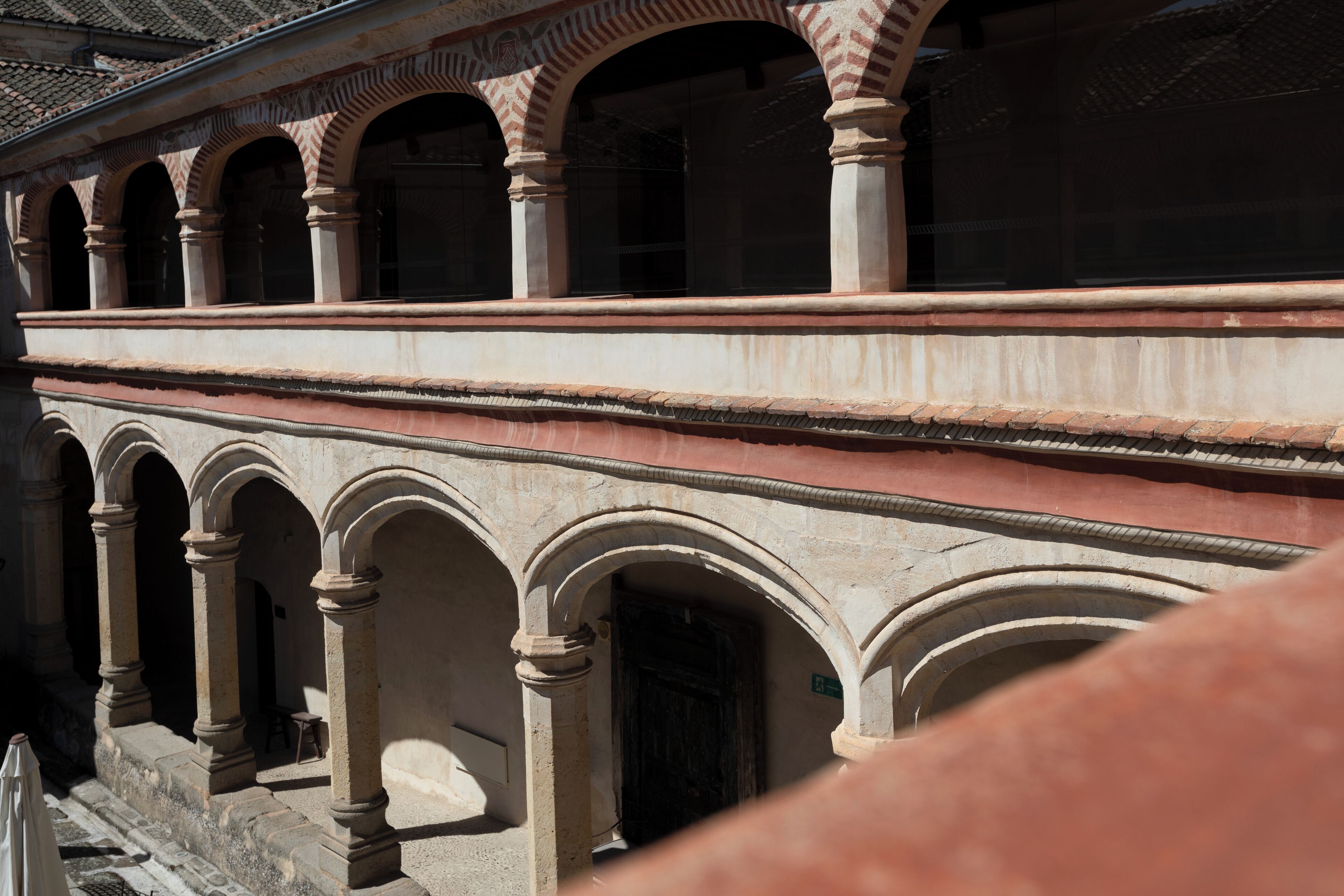A building with a series of arches and columns, suggesting a historical or architectural significance.