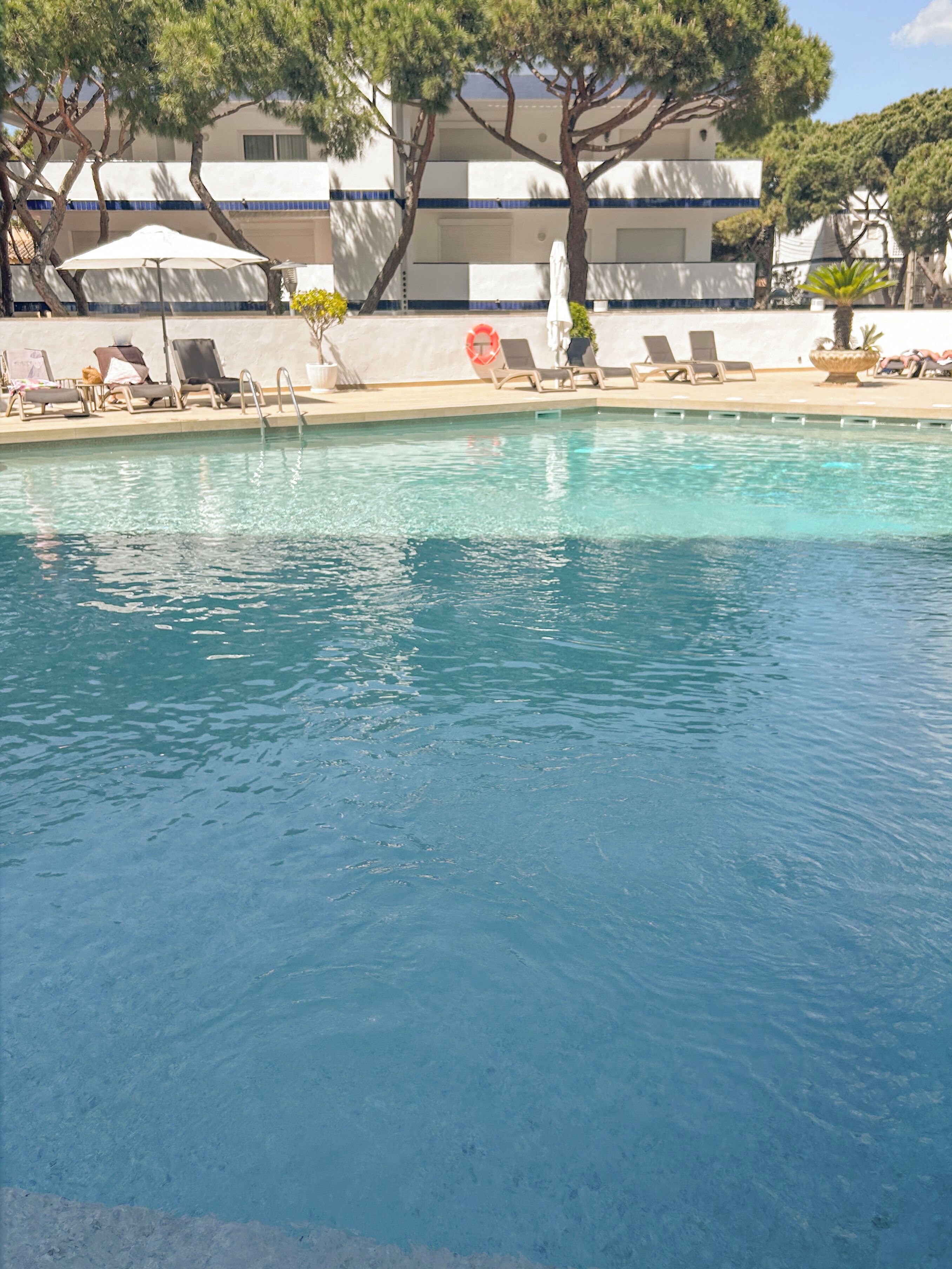 seasonal outdoor pool, open 10:00 am to 8:00 pm, pool umbrellas
