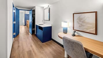 Hypo-allergenic bedding, desk, laptop workspace, blackout drapes