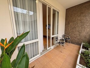Suite, 1 Bedroom, Balcony | Living area | 32-inch LCD TV with cable channels, TV