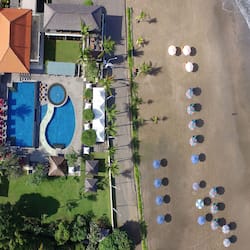 Relax by the ocean with a view from our infinity pool and bungalow-style accommodations.