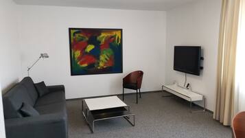 Chambre Triple | Coin séjour