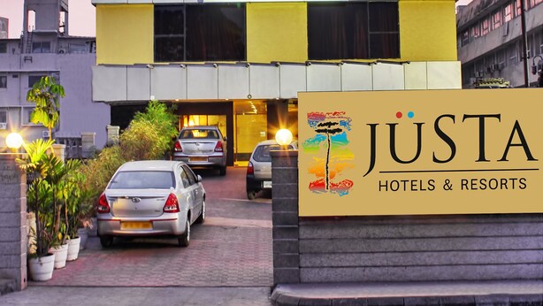 A modern hotel entrance with a sign reading "JUSTA Hotels & Resorts". - juSTa Hyderabad (Hyderabad)