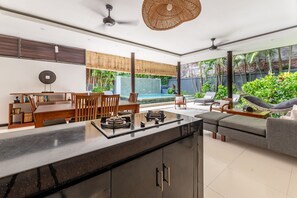 Deluxe Two Bedroom Pool Villa | Living area | 32-inch LCD TV with cable channels, TV, iPod dock - Villa Coco (Seminyak)