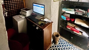 A small office with a desktop computer, a printer, and a filing cabinet. - Riad Damia Suite &Spa (Fes)
