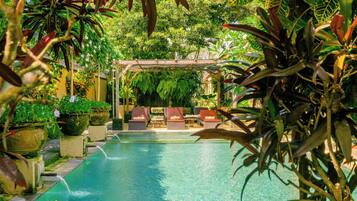 Outdoor pool, open 7:00 AM to 10:00 PM, pool umbrellas, sun loungers