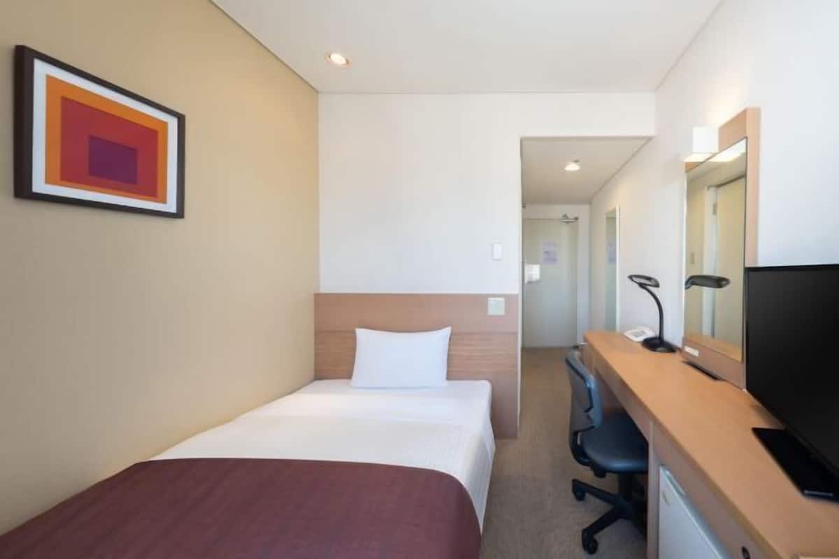 Desk, blackout curtains, free WiFi, bed sheets