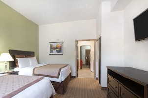 Suíte executiva, 1 quarto, para não fumantes, banheira de hidromassagem | 1 quarto, roupas de cama premium, cofres nos quartos, escrivaninha