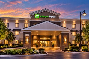 A Holiday Inn Express hotel with a modern facade, a prominent entrance, and a well-lit exterior. - Holiday Inn Express Hotel & Suites Lincoln by IHG (Lincoln)