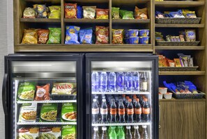 A vending machine stocked with snacks and beverages. - Holiday Inn Express Hotel & Suites Kansas City - Grandview by IHG (Grandview)