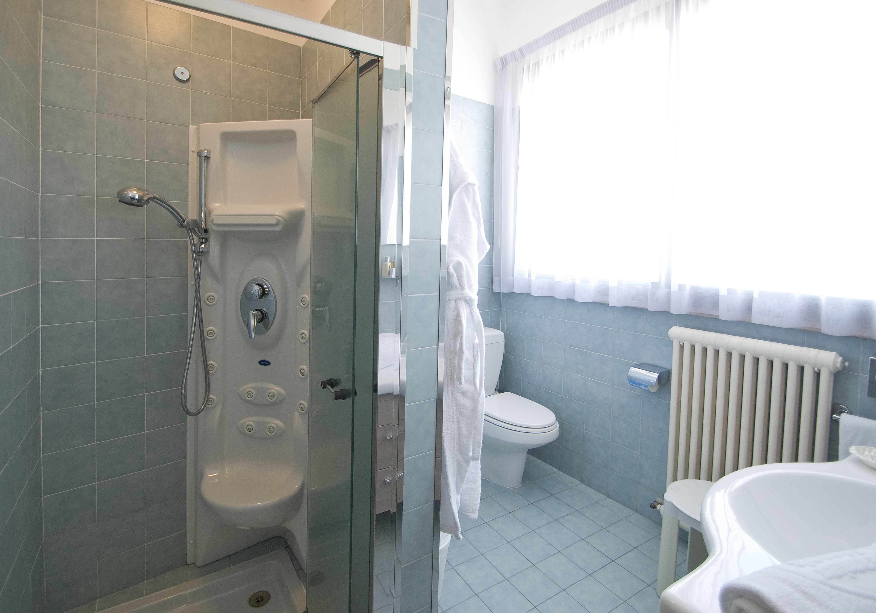 hair dryer, slippers, bidet, towels