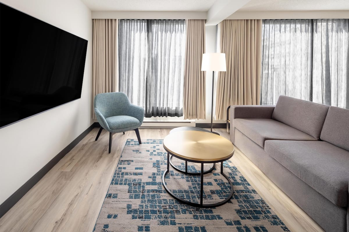Presidential Suite, 1 Bedroom | Living area | 42-inch LCD TV with cable channels, TV, pay movies
