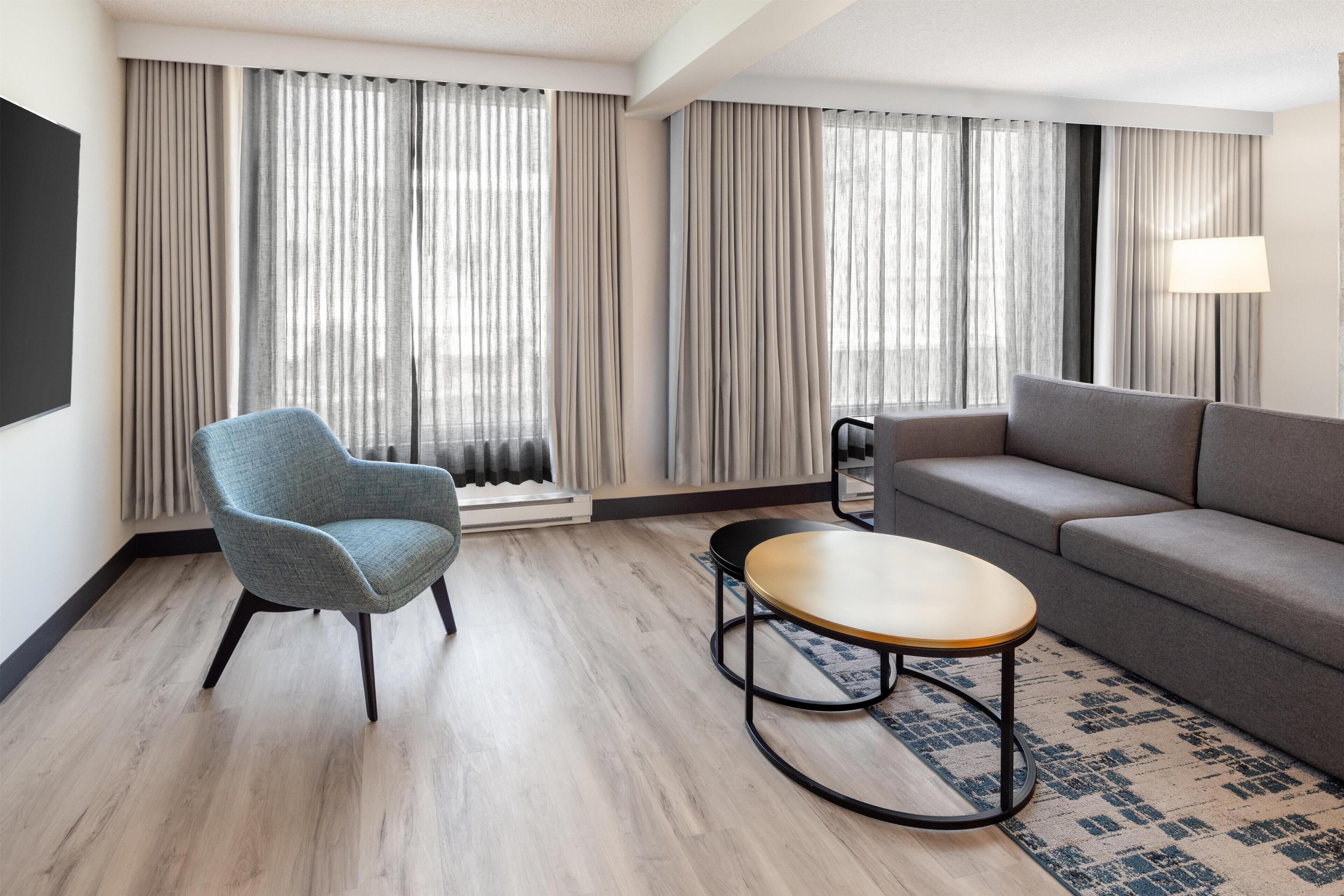 Presidential Suite, 2 Bedrooms | Living area | 42-inch LCD TV with cable channels, TV, pay movies