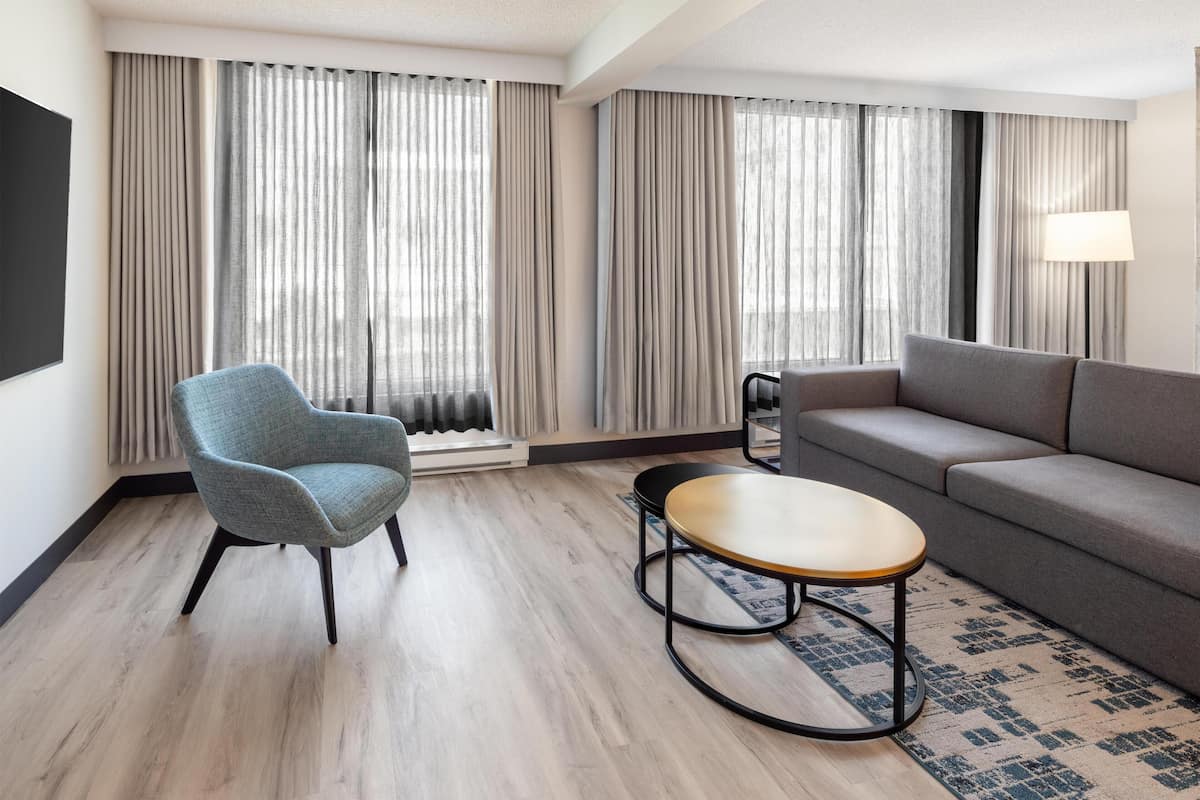 Presidential Suite, 2 Bedrooms | Living area | 42-inch LCD TV with cable channels, TV, pay movies