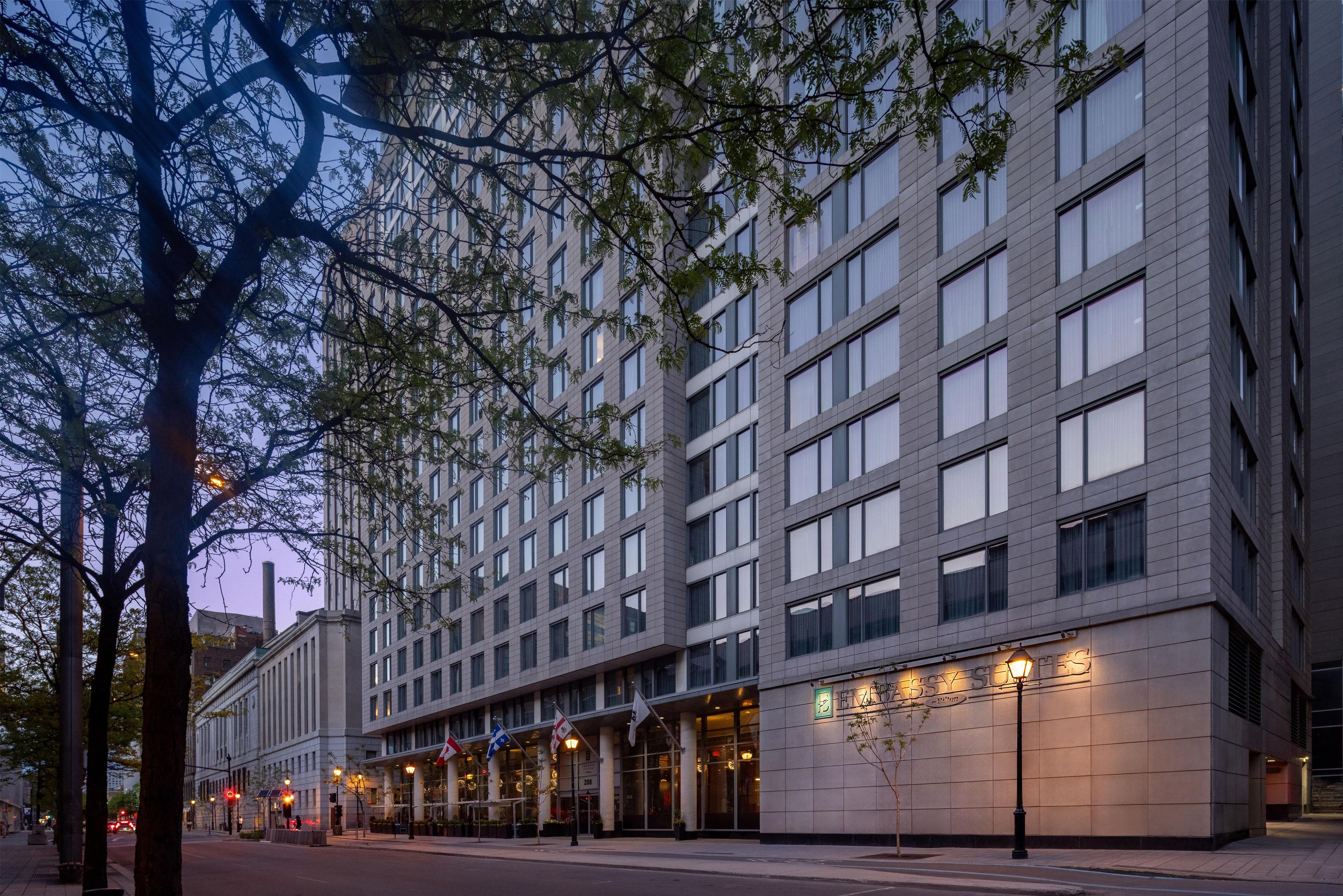 A modern hotel with a large number of windows and a prominent entrance.