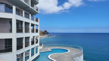 Indoor pool, outdoor pool, pool umbrellas