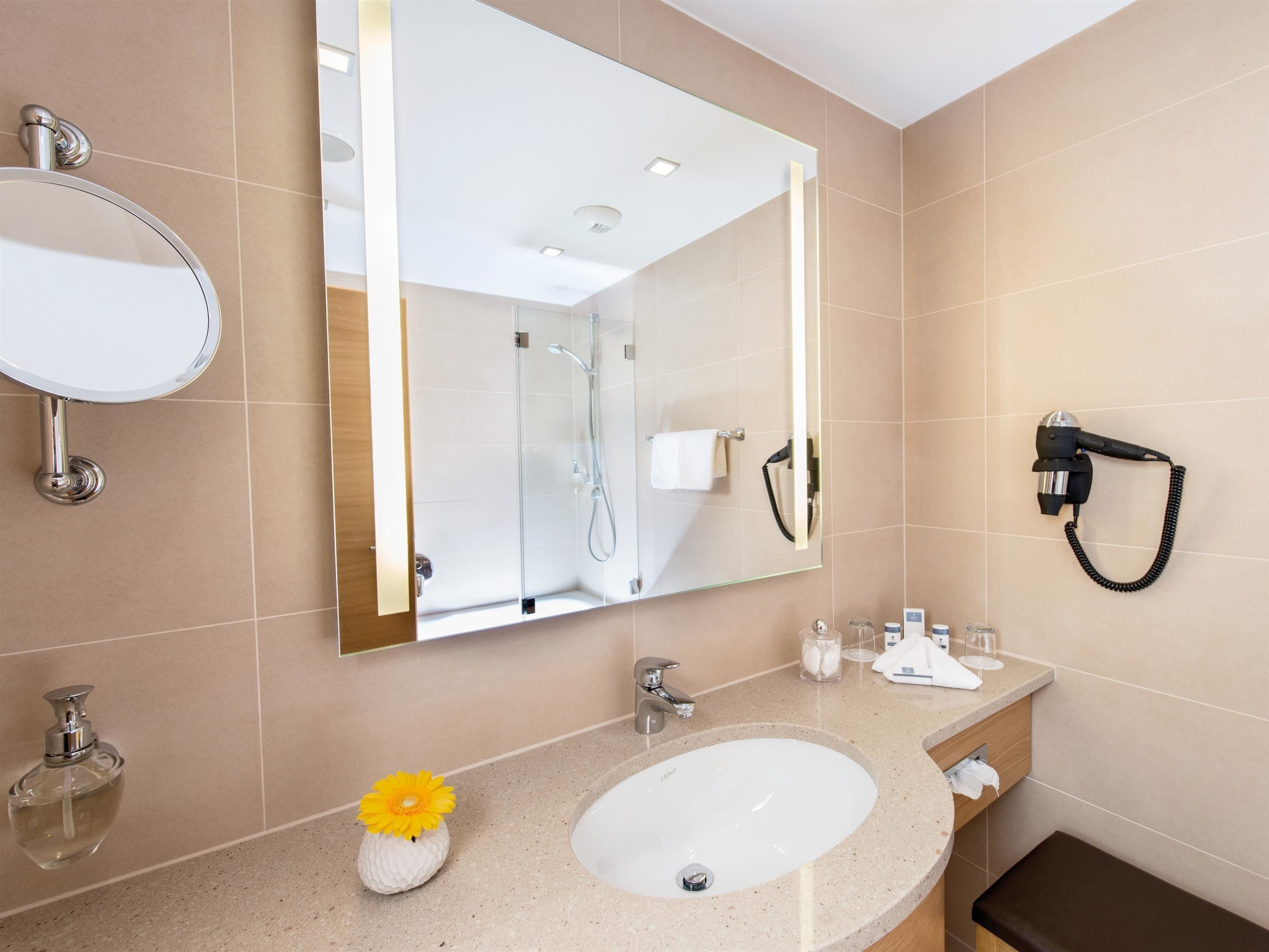 designer toiletries, hair dryer, bathrobes, slippers