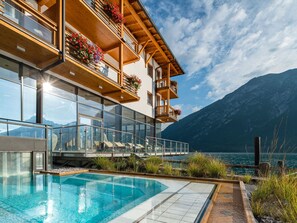 Enjoy a refreshing swim in our outdoor pool with a stunning mountain view.