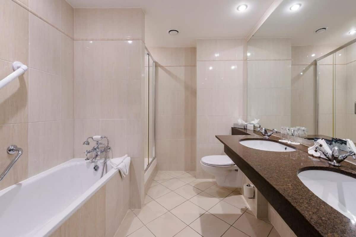 combined shower/bathtub, deep-soaking bathtub, designer toiletries