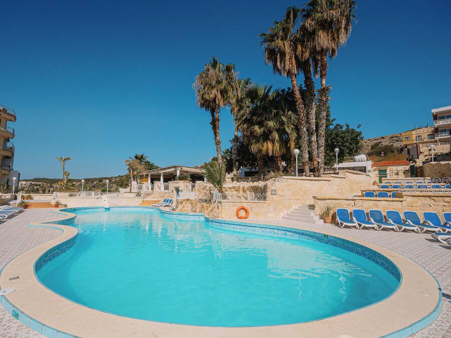 Outdoor pool, open 9:00 AM to 4:30 PM, pool umbrellas, sun loungers