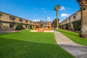 Outdoor pool, open 6:00 AM to 10:00 PM, pool umbrellas, sun loungers - Quality Inn & Suites Goodyear - Phoenix West (Goodyear)