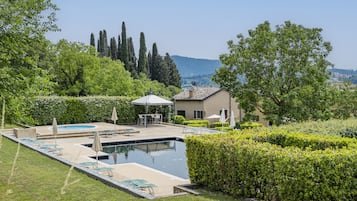 Outdoor pool, pool umbrellas, sun loungers