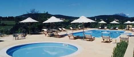 2 outdoor pools, pool umbrellas, pool loungers