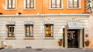 A hotel facade with three distinct sections labeled "AU," "PATIO," and "MORAND." - Hotel Au Patio Morand (Lyon)