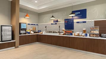 A modern breakfast area with a counter displaying various food items and a sign for 'Express Breakfast'.