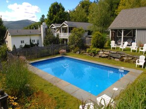 Seasonal outdoor pool, pool umbrellas, pool loungers