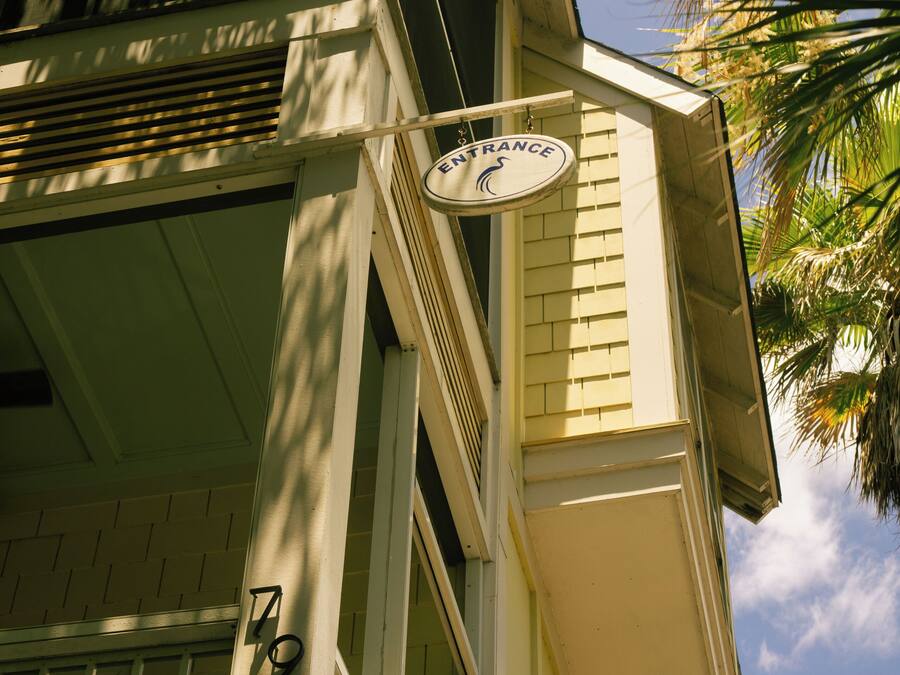 A building with a sign reading 'ENTRANCE' and a number '79' on the facade.