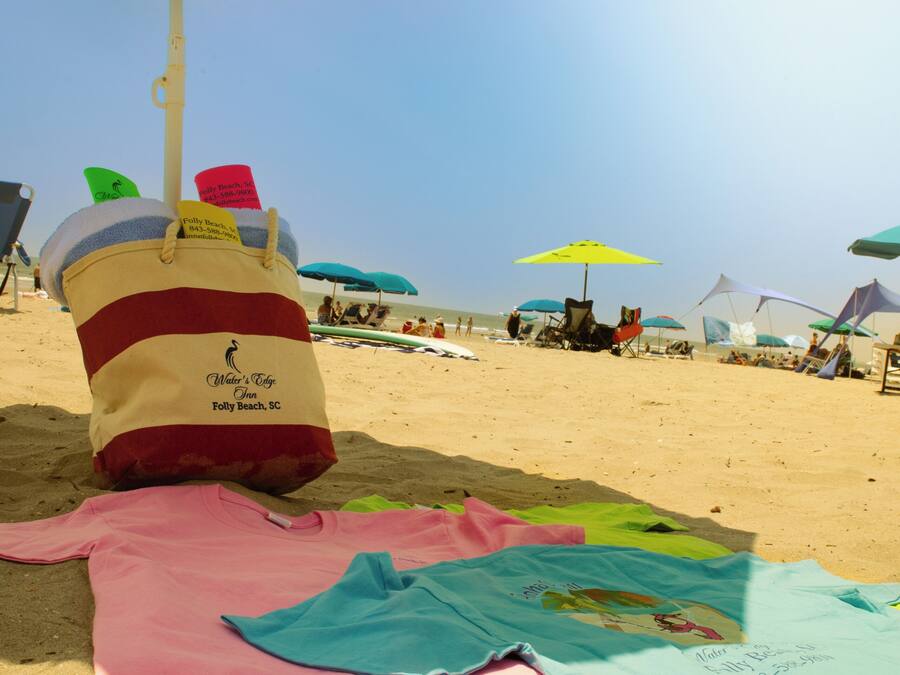 A beach scene with multiple umbrellas and beach chairs.