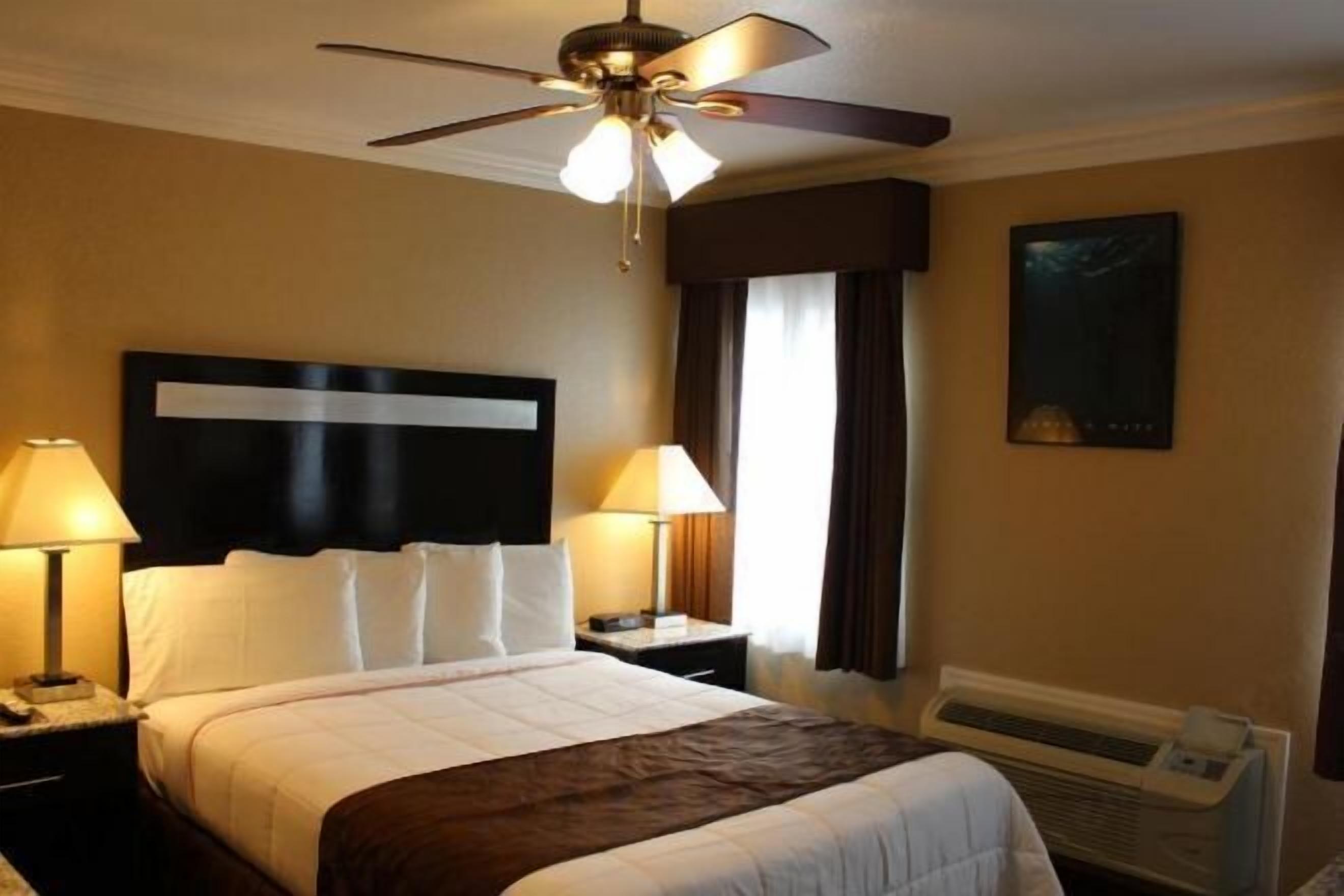 Premium bedding, pillow-top beds, desk, laptop workspace