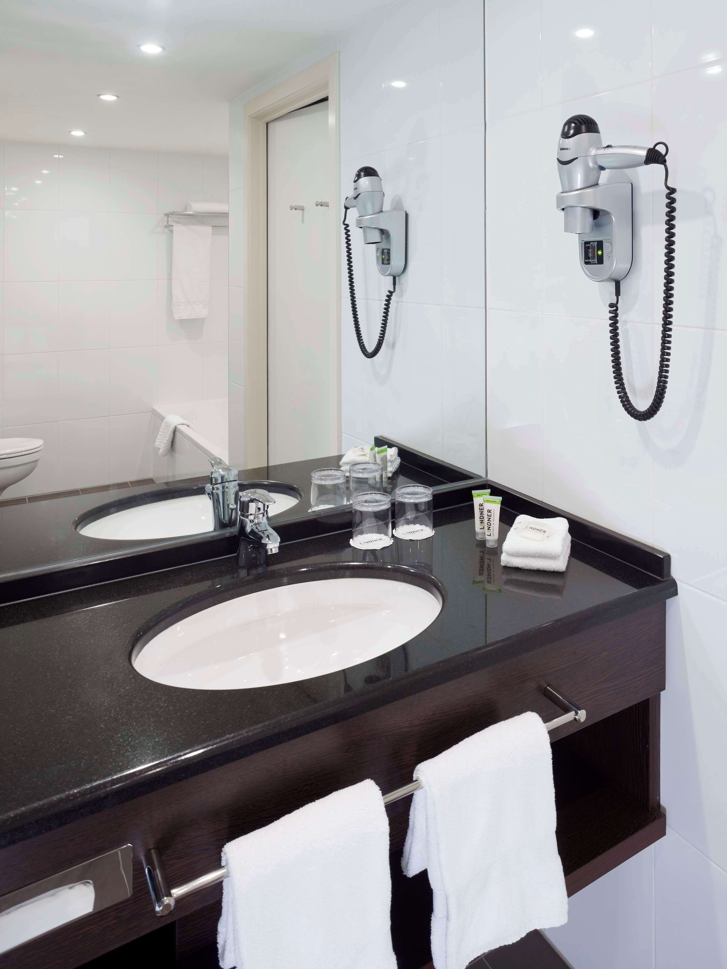 eco-friendly toiletries, hair dryer, heated floors, towels