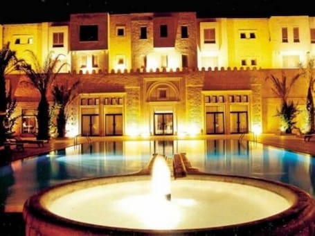 Seasonal outdoor pool, open 10:00 AM to 5:00 PM, pool umbrellas