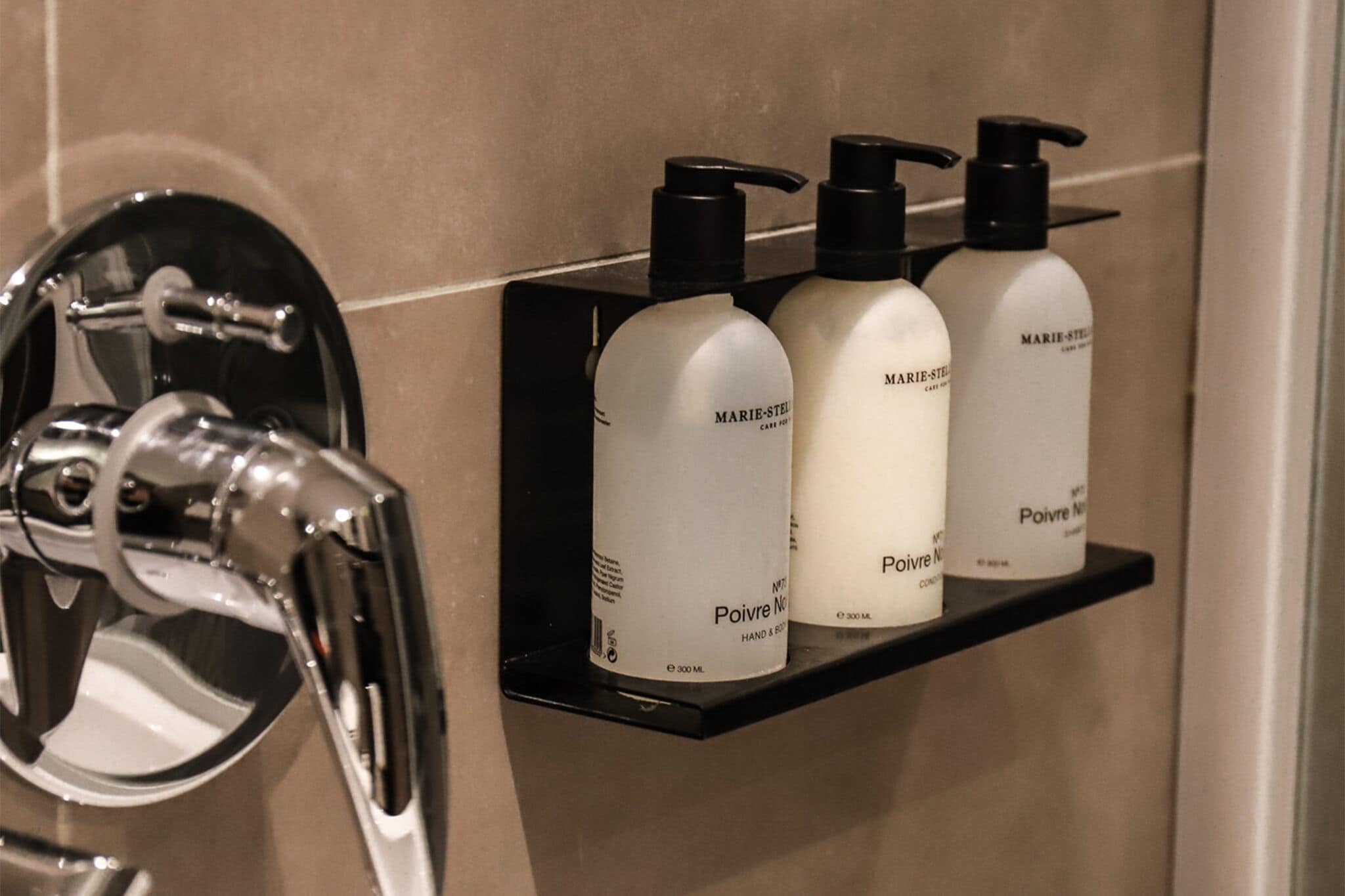 designer toiletries, hair dryer, bathrobes, slippers