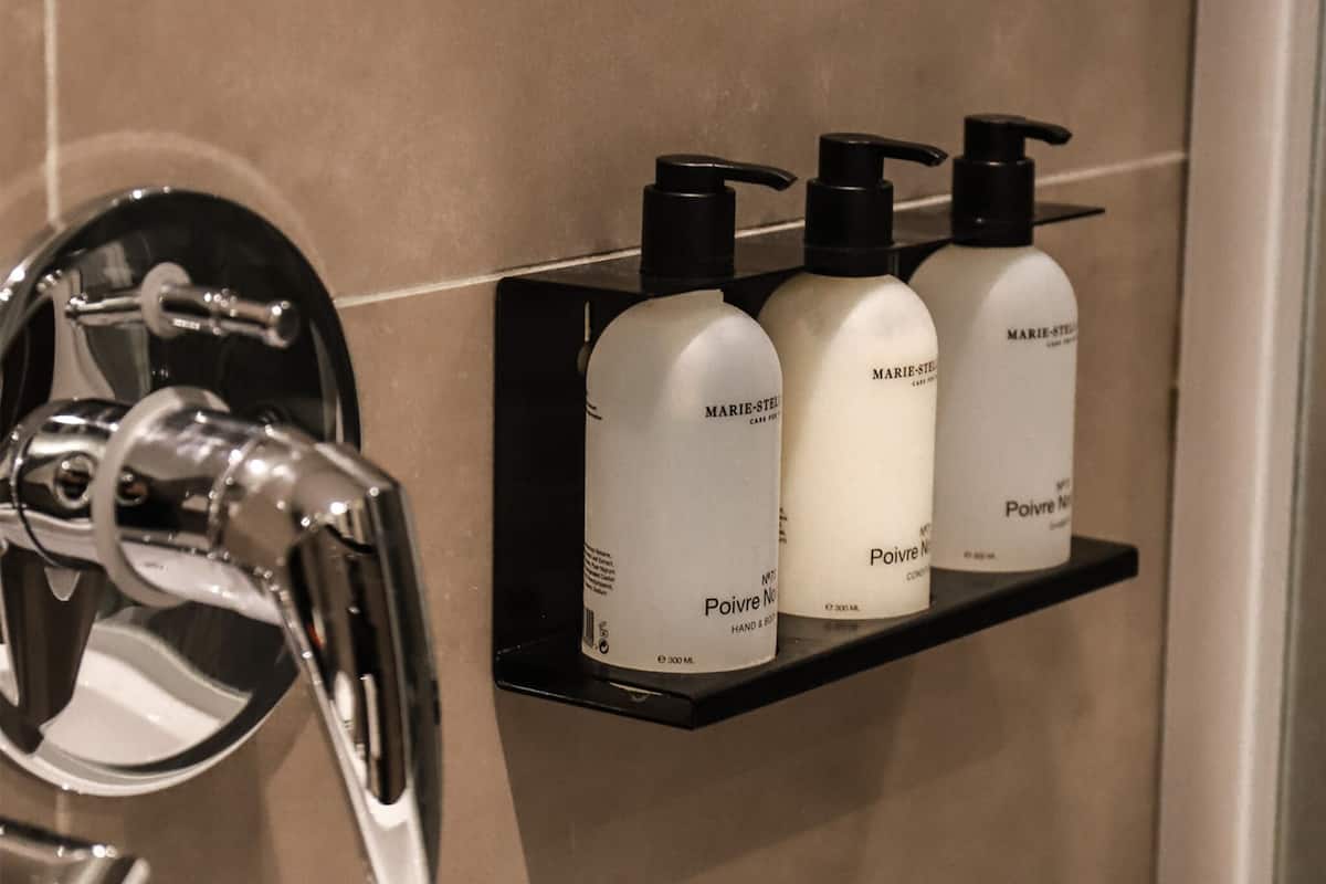 designer toiletries, hair dryer, bathrobes, slippers